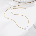 Detalle de collar ojo turco dorado con cierre de langosta y cadena de extensión ajustable - Dorado