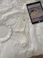 Detail of white ribbed cotton socks featuring cute panda embroidery in a cozy home setting - One Size / White Dog Style