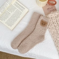 Close-up of khaki coral fleece socks with cute bear embroidery in a cozy home setting - One Size / Khaki