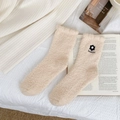 Close-up of soft white coral fleece socks featuring 3D floral embroidery and pearl accents - One Size / Yellow