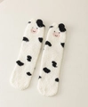Winter coral fleece socks featuring black and white cow spots and cute cow embroidery - White