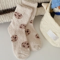 Beige coral fleece socks with dark brown polka dots in a cozy home setting - One Size / Cookies
