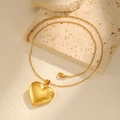 Vintage heart locket necklace in gold finish with intricate floral engraving on stone - Gold Pendant With Chain