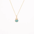 Detailed macro view of a gold-plated necklace with turquoise gourd pendant and pavé zircons - Turquoise Gourd Style (ZG115)