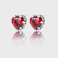 Close-up of S925 silver heart studs featuring faceted ruby-colored zircon and claw setting - Red (KDP781)