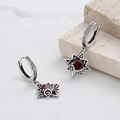 Macro view of vintage 925 silver star earrings with red zircon and bohemian patterns - Retro Star Red Rhinestone Earrings (KDP965)