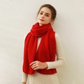 Deep red knitted scarf with thick ribbed texture shown in a cozy winter wrap style - Flame Red