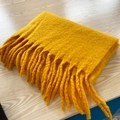 Folded soft mustard yellow mohair scarf with thick fringes for winter warmth - Turmeric