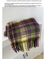 Close-up of multicolor plaid scarf fabric texture and washing instructions labels - Purple & Green Plaid
