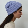 Winter wool blend rib-knit beanie in lavender purple, shown on model with white sweater - Violet Blue