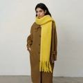 Thick bright yellow pashmina scarf with fringe detail over a brown winter coat - Lemon Yellow