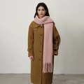 Thick light pink cashmere-feel scarf with tassels paired with a camel wool coat - Pink