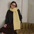 Bright yellow chunky knit scarf with diamond pattern on a model wearing grey coat - Yellow