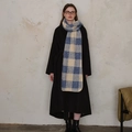 Blue and beige plaid wool scarf paired with a black long coat for winter style - Blue Beige