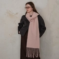 Pink wool-blend knitted scarf with long tassels worn over a dark grey winter coat - Pink Red Multi
