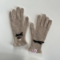 Elegant oatmeal wool knit gloves with vintage buttons and black ribbon bow detail - Ice Grey