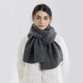 Thick dark grey cable knit scarf for women shown on a model for winter warmth - Charcoal Gray