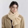 Beige ribbed knit scarf with woven label detail and soft cashmere-like texture - Light Apricot