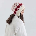 Winter knitted earflap hat with red hexagonal patterns in white and red color contrast - Orange