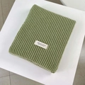 Grass green ribbed knit scarf with a white woven label for a warm winter stylish look - Fruit Green