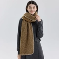 Thick brown bouclé scarf with white stitched edges on a model for winter warmth - Coffee