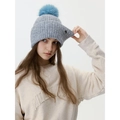 Gray knitted beanie with blue faux fur pompom and metal logo for winter warmth - Ice Gray