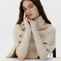 Beige knitted turtleneck poncho with matching arm sleeves and side button details - Off White