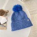 Blue knit beanie with fluffy pompom and silver metal logo on soft mohair texture - Starry Night Blue