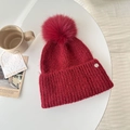 Thick dark red knit beanie with a large fluffy pom-pom and silver metal detail - Red