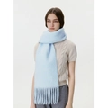 Light blue wool-touch scarf with long tassels worn over a beige knit sweater - Clear Sky Blue