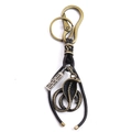 Portachiavi retrò con ciondolo a cobra, moschettone in ottone e cordino in pelle - Bronzo