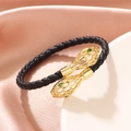 Braided black leather bracelet with golden hollow snake heads and green stone eyes - Black