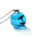 Detail of blue globe pendant with white clouds and flying bird silhouettes on silver chain - Two Blue Birds