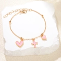 Elegante pulsera de cadena dorada con dijes de corazón y cruz rosa en piedra - Rosa