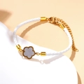 Bracciale a corda intrecciata bianca con ciondolo a quadrifoglio in oro 18k regolabile - Bianco