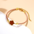 Pinkish brown braided rope bracelet with a gold-framed reddish brown flower charm - Rose Gold