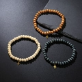 Three-piece wooden beaded bracelet set with golden cross pendants on a dark background - Multicolor Wood Bead Cross Style