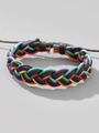 Vue détaillée d'un bracelet en cuir tressé style jamaïcain avec cordons de coton colorés - Style Tissé Coloré