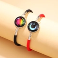 Handmade woven couple bracelets with luminous sun and moon glass pendants in black and red - Black Red Colorful Sun Moon Set