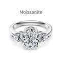 Three-stone Moissanite ring featuring oval center stone and pear-shaped side diamonds - US 9 / White Gold Color (DO120064-S-W-WH)