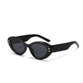 Occhiali da sole neri cat-eye con lenti grigio scuro e dettagli in metallo oro - Nero Lucido