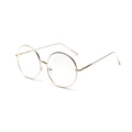Classic round glasses with slim gold metal frames and clear lenses for a retro look - Gold