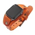 Brown leather cuff watch band with vintage studs for Apple Watch from a 45-degree angle - 38/40MM Orange