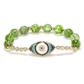 Evil Eye beaded bracelet with green crystal stones and gold-plated zircon charms - Olive Green
