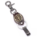 Vintage bronze lion leather keychain with metal hooks and brown braided strap detail - Bronze