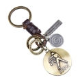 Portachiavi Bilancia vintage in pelle intrecciata con targhette in ottone e anelli stile punk - Bilancia