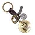 Porte-clés Sagittaire en bronze rétro avec bracelet en cuir tressé et breloques métal - Sagittaire