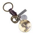 Porte-clés rétro en cuir tressé marron avec médaillon en bronze du signe Scorpion - Scorpion