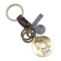Porte-clés rétro en cuir tressé avec breloque Lion et anneaux en métal bronze antique - Lion