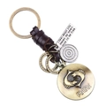 Porte-clés en cuir tressé avec signe du zodiaque Poissons en bronze et pendentifs variés - Poissons